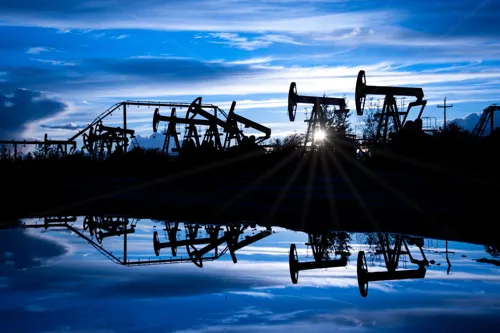 Crude prices fall after IEA cuts 2026 oil demand outlook, but Hormuz risk keeps pump prices volatile